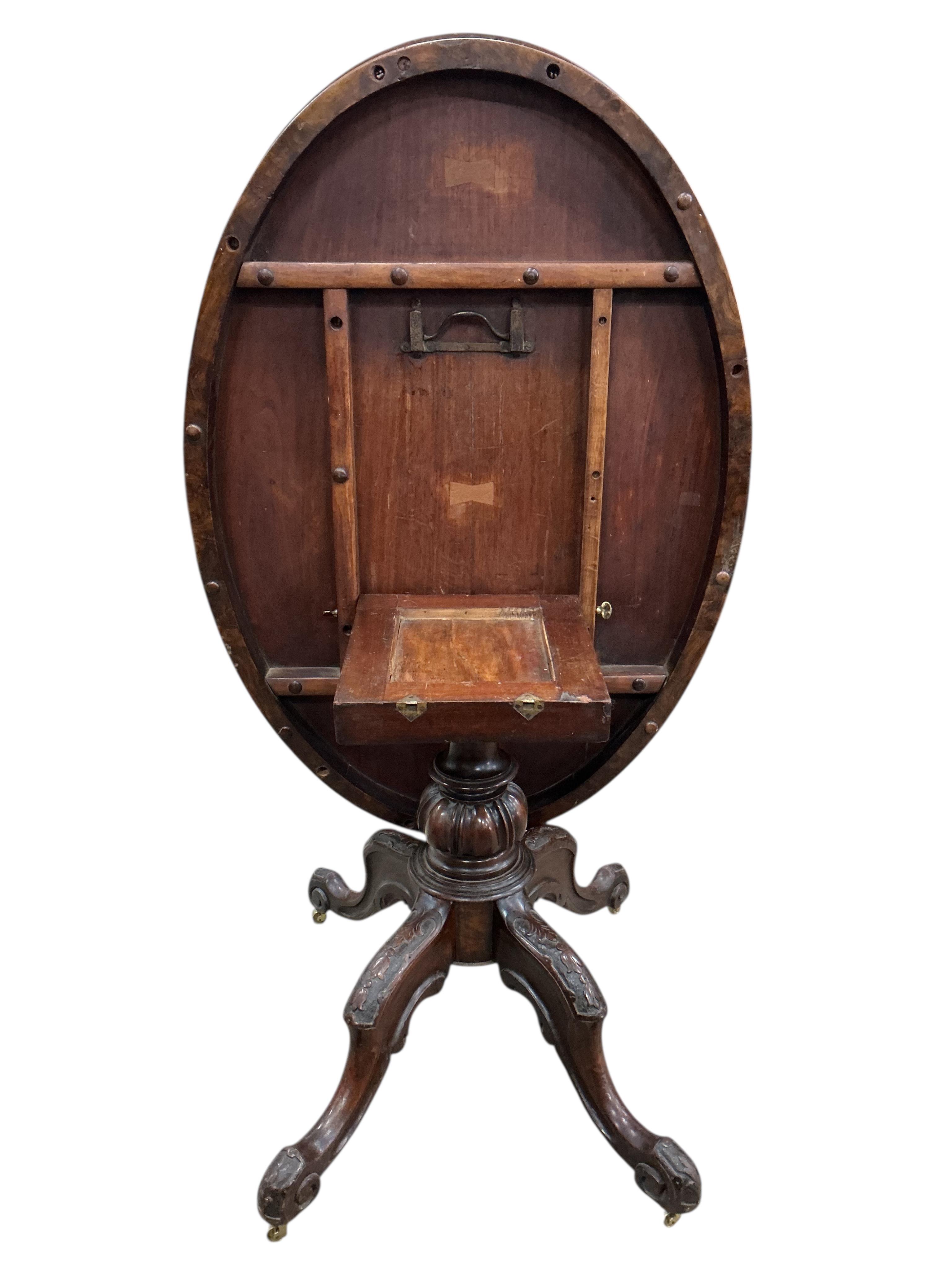 A Victorian figured walnut oval tilt top loo table, width 84cm, depth 122cm, height 72cm